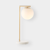 Remi Desk Lamp with antique brass finish, white marble base, and frosted glass shade in mid-century modern style