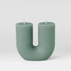 Black Blaze candles Curl Curl sage green U-shaped sculptural candle made from plant-based wax