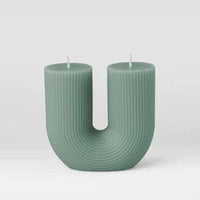 Black Blaze candles Curl Curl sage green U-shaped sculptural candle made from plant-based wax