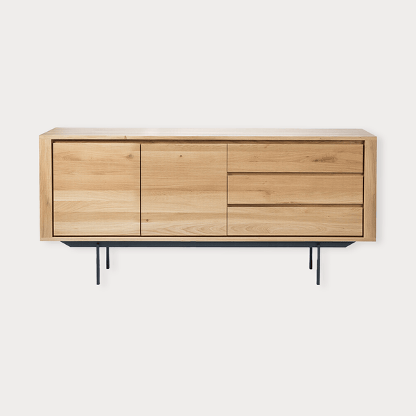 Ethnicraft Oak Shadow Sideboard made of natural solid European oak with three doors and drawers on a black metal base