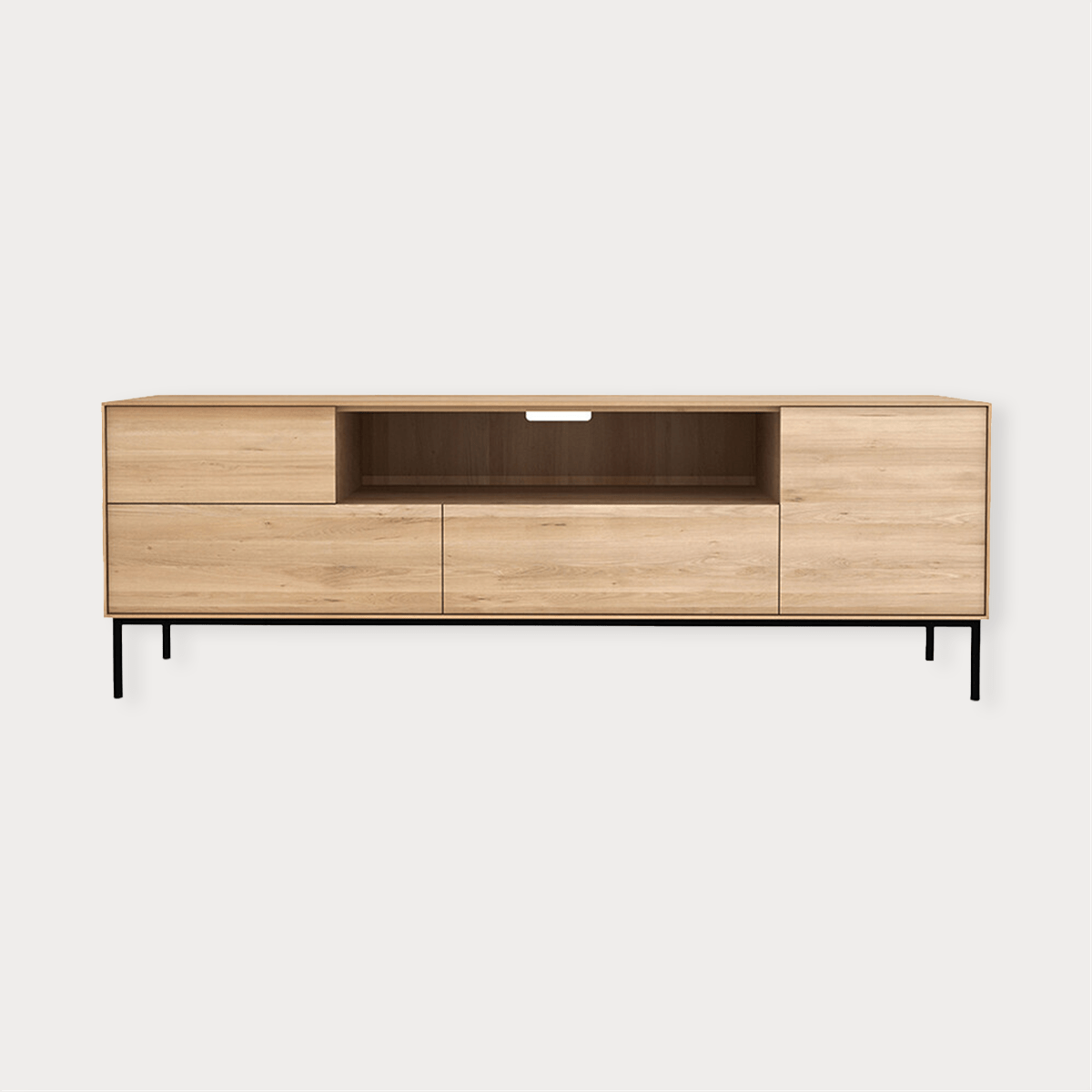 Ethnicraft Whitebird Entertainment Unit in natural oak with one door, one flip-down door, two drawers, and black legs.