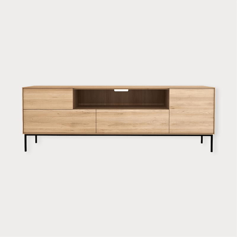 Ethnicraft Whitebird Entertainment Unit in natural oak with one door, one flip-down door, two drawers, and black legs.