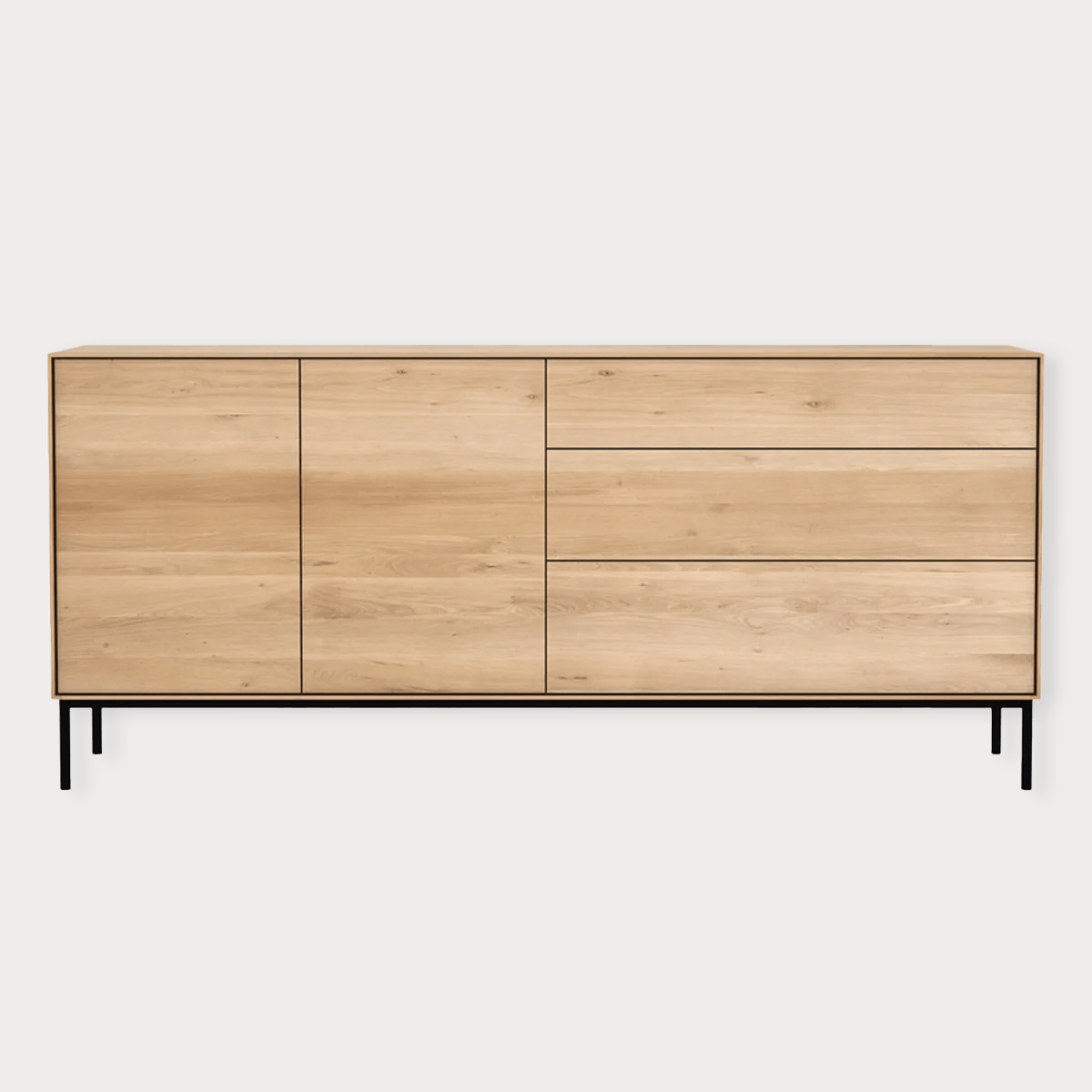 Ethnicraft Whitebird Sideboard with natural oak finish, 2 doors, 3 drawers, and black metal legs.