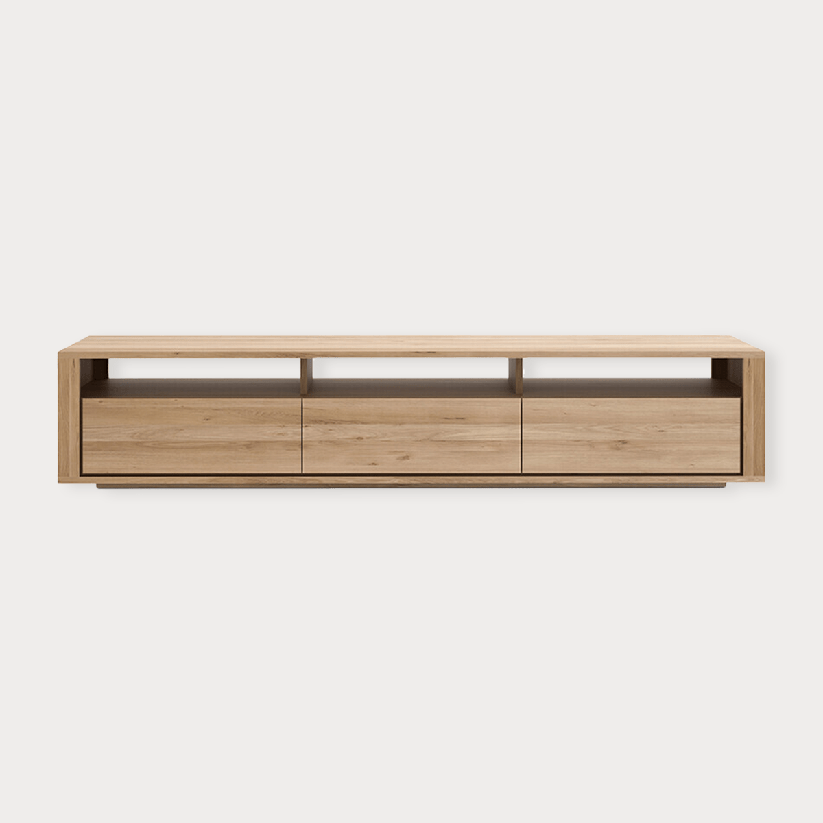 Ethnicraft Shadow TV Stand in natural oak with three drawers and open shelves, modern low-profile entertainment unit.