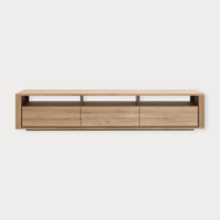 Ethnicraft Shadow TV Stand in natural oak with three drawers and open shelves, modern low-profile entertainment unit.
