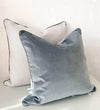 Handmade norsu cushion pair featuring Lindeman Snow fabric with charcoal piping and a soft grey velvet cushion.