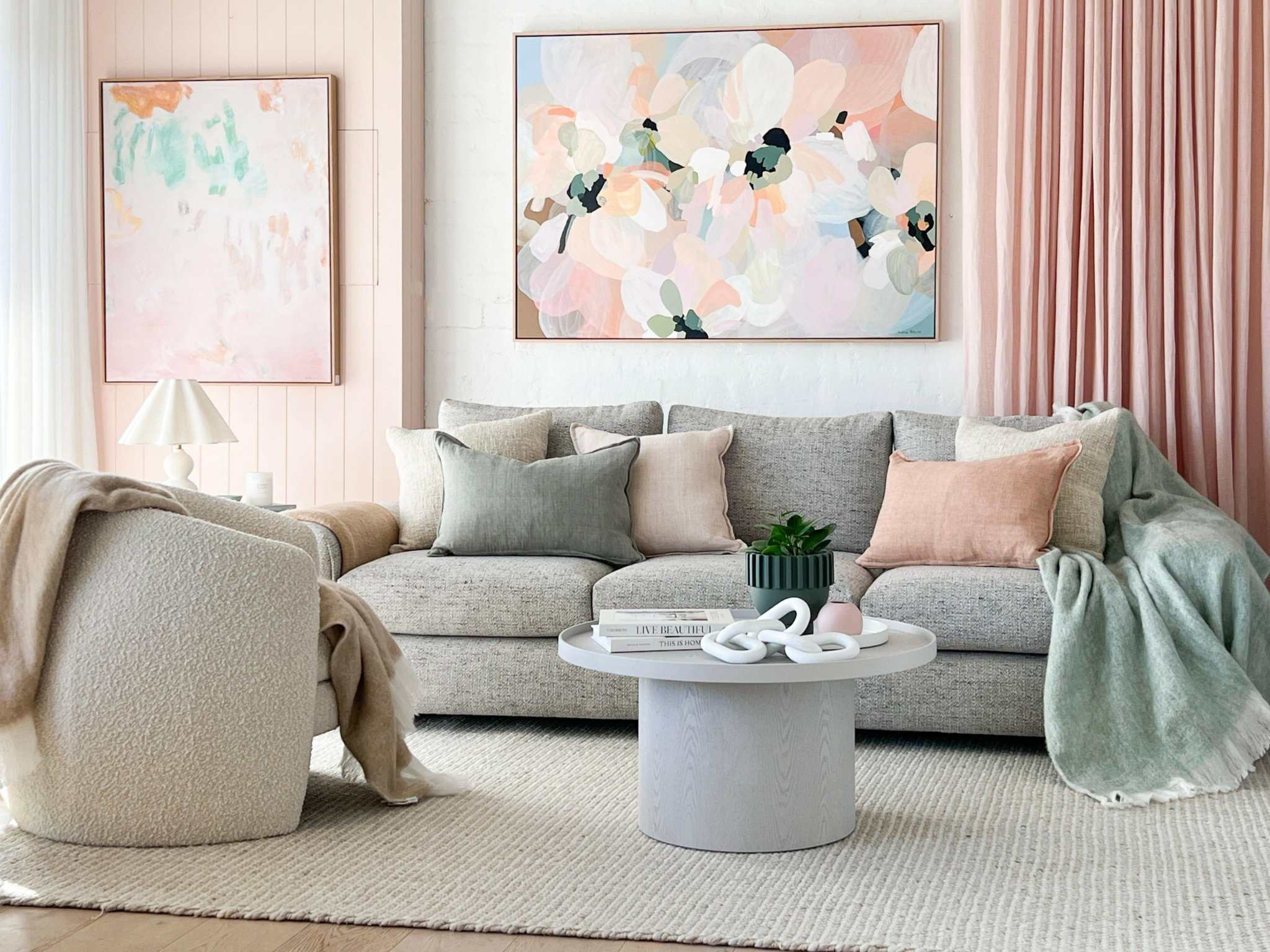 norsuHOME sofa in a stylish living room with pastel cushions and modern art, showcasing comfort and Australian design