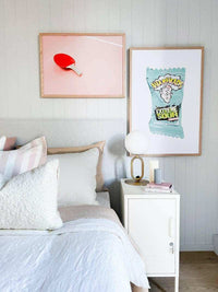 Compact Mustard Made Locker in Chalk with handle and lock next to bed in a modern bedroom setting