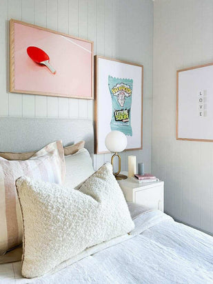 Dom Gauci Kids Art Print Sour Power displayed in cozy bedroom with framed artwork and soft pillows