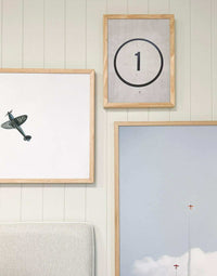 THANK U Print wall art in various sizes with wooden frames, featuring minimalist designs including an airplane and a circle with number one, perfect for stylish home decor