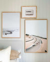 Wing Print photographic wall art in various frame sizes displayed above a bed