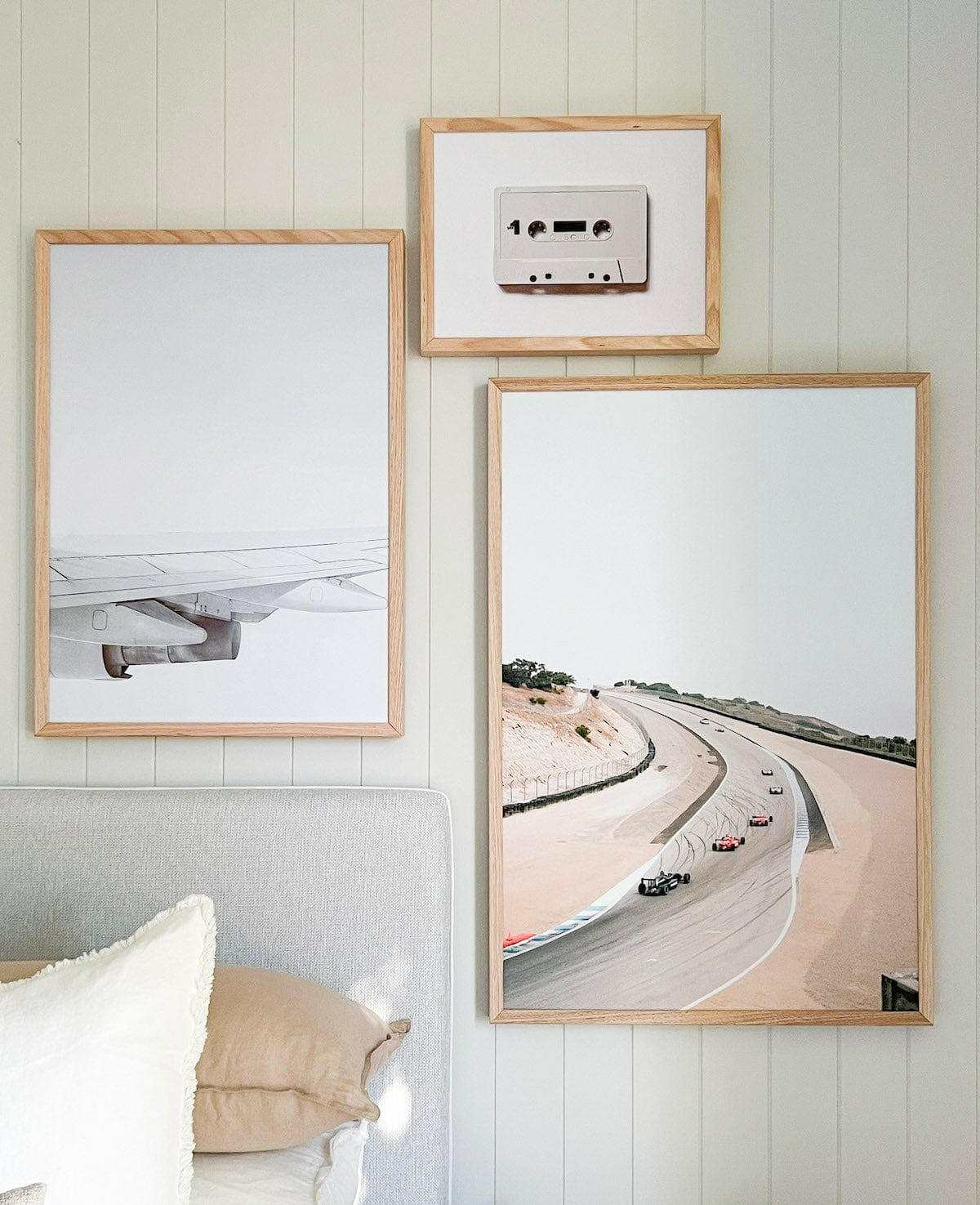 Wing Print photographic wall art in various frame sizes displayed above a bed
