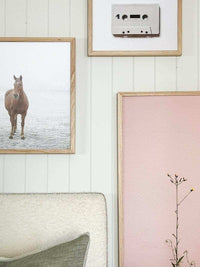 Bold inspiring wall art prints in various sizes with natural and minimalist designs framed in light wood.