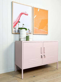 Blush pink Mustard Made Locker with double doors, handles, locks, and ventilation vents in modern room setting