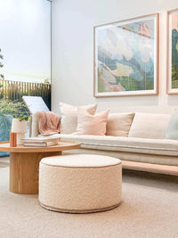 norsu Design your Own Ottoman in blush leather piping with soft, foam-filled fabric, styled in a modern living room setting
