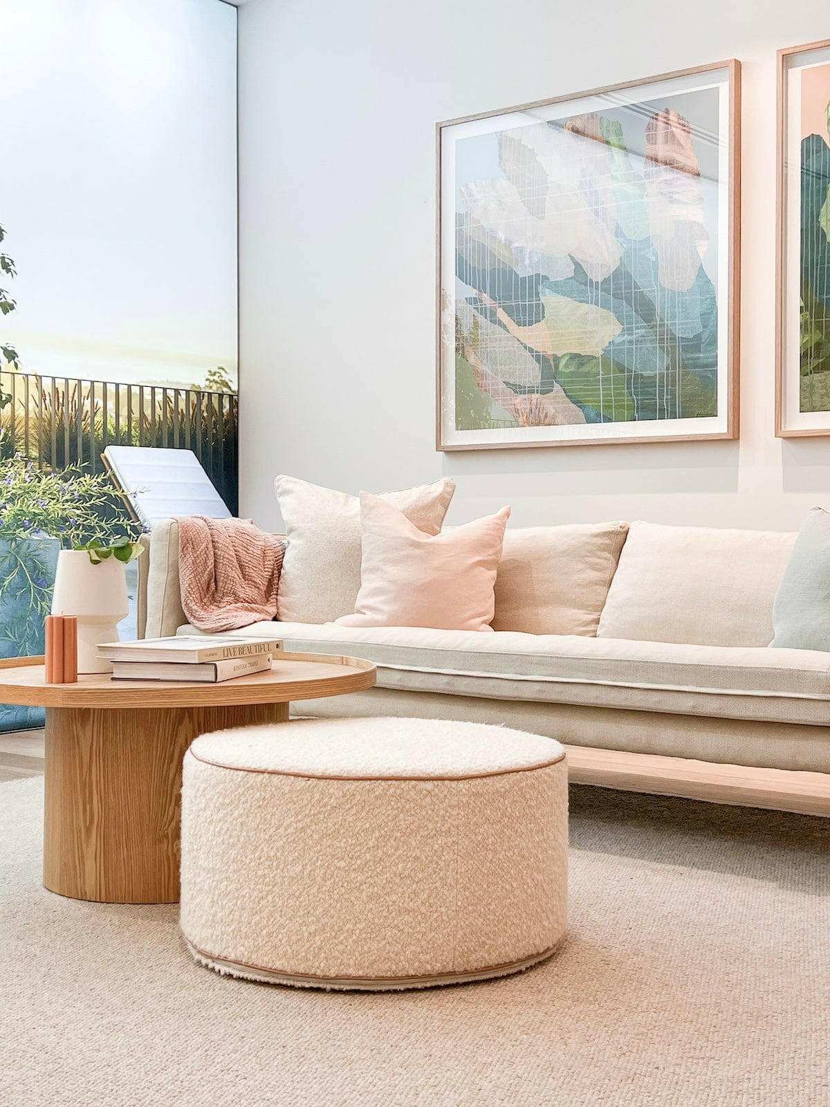 norsu Design your Own Ottoman in blush leather piping with soft, foam-filled fabric, styled in a modern living room setting