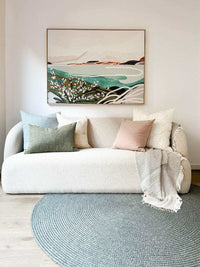 Blush norsu Studio Washable Cushion on sofa with neutral throw in modern living room