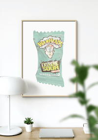 Dom Gauci Kids Art Print featuring Warheads Extreme Sour candy design in framed print displayed on wall above desk.