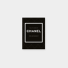 The Little Book Of Chanel fashion monograph with black cover and white text detailing Chanel's legacy and iconic designs.