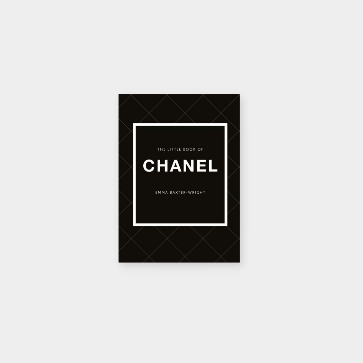 The Little Book Of Chanel fashion monograph with black cover and white text detailing Chanel's legacy and iconic designs.