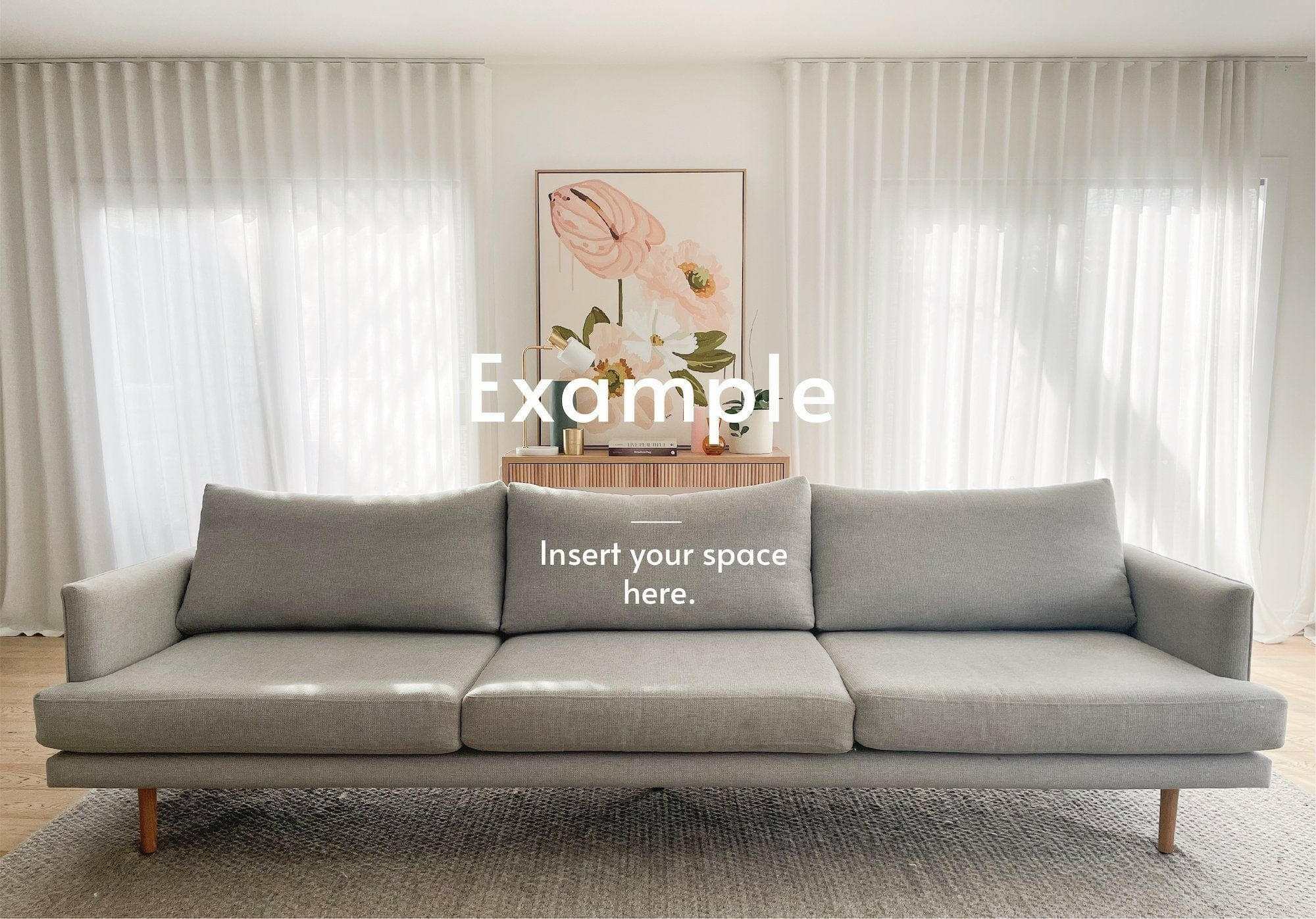 Modern gray sofa in a bright living room with floral wall art and sheer curtains, example for bedlinen andor cushions virtual styling service
