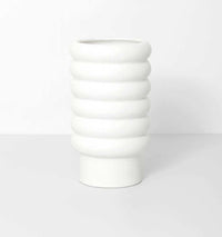 White porcelain Alder Pot planter with a textured bubbly matte exterior and gloss glazed interior, available in various sizes