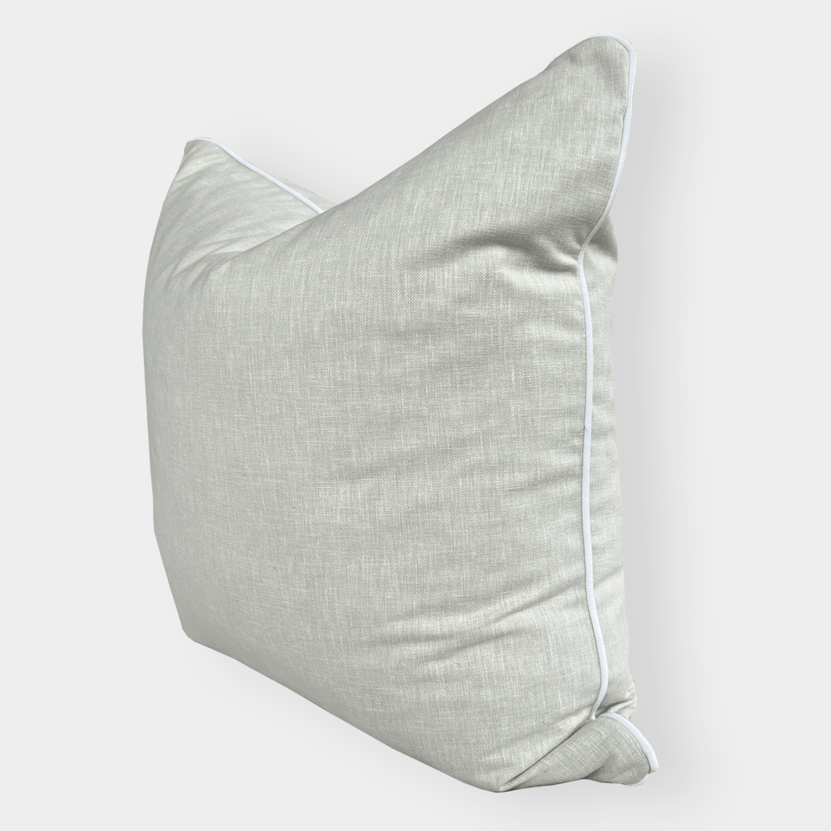 norsu Studio Cushion in Cole Aloe fabric with white piping, handmade with feather down filling, available in various sizes