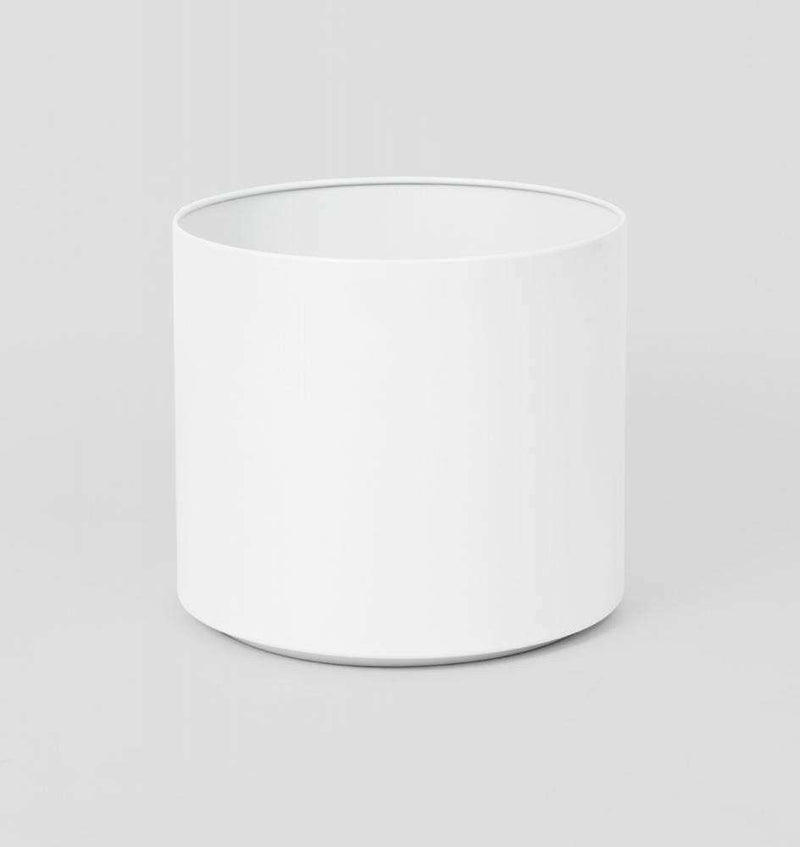 White Benny Planter made of powder-coated stainless steel with drainage hole, medium size.