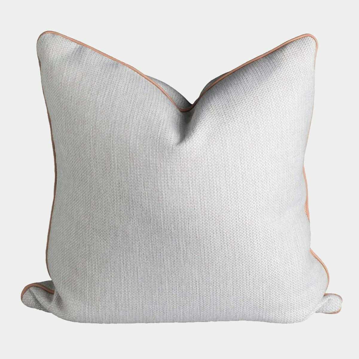 norsu Studio Cushion in Lindeman Snow fabric with blush piping, handmade feather down cushion from Melbourne designed with Warwick fabrics