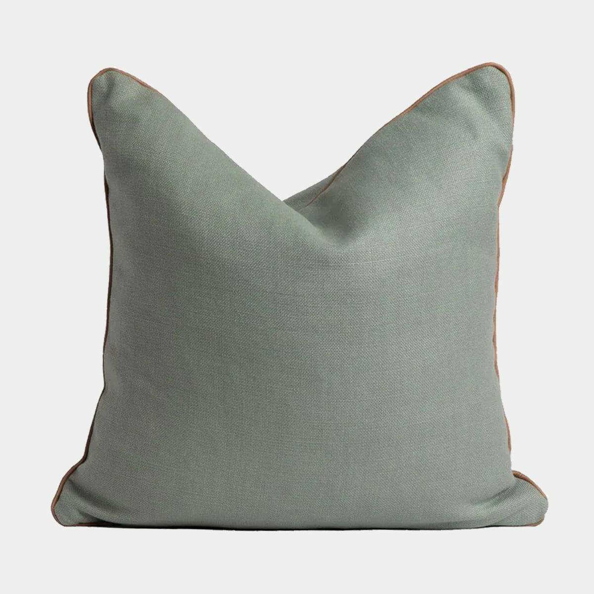 norsu cushion in celadon fabric with blush leather piping, handmade decorative pillow
