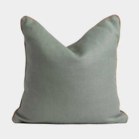 norsu cushion in celadon fabric with blush leather piping, handmade decorative pillow