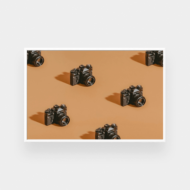 Framed photographic print of vintage cameras pattern on brown background in various sizes Click Print