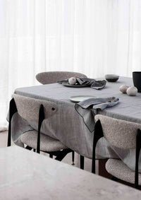 Rendr Amara Stitch 100% linen tablecloth in cool grey with embroidered edging on dining table