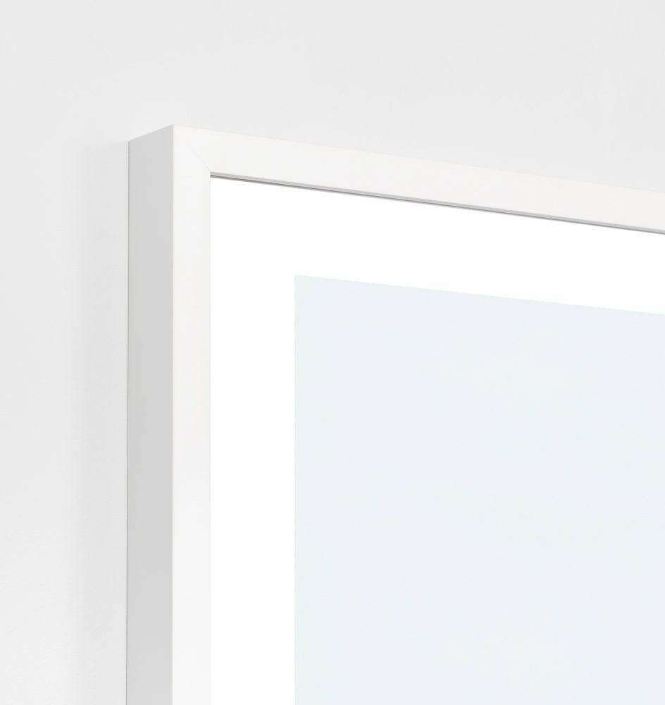 Close-up of a white framed Middle of Nowhere Cuba Print photographic art piece on wall