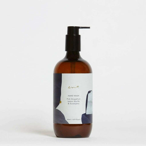 Ena hand wash bottle with pink grapefruit, lemon myrtle, and eucalyptus essential oils in amber pump dispenser