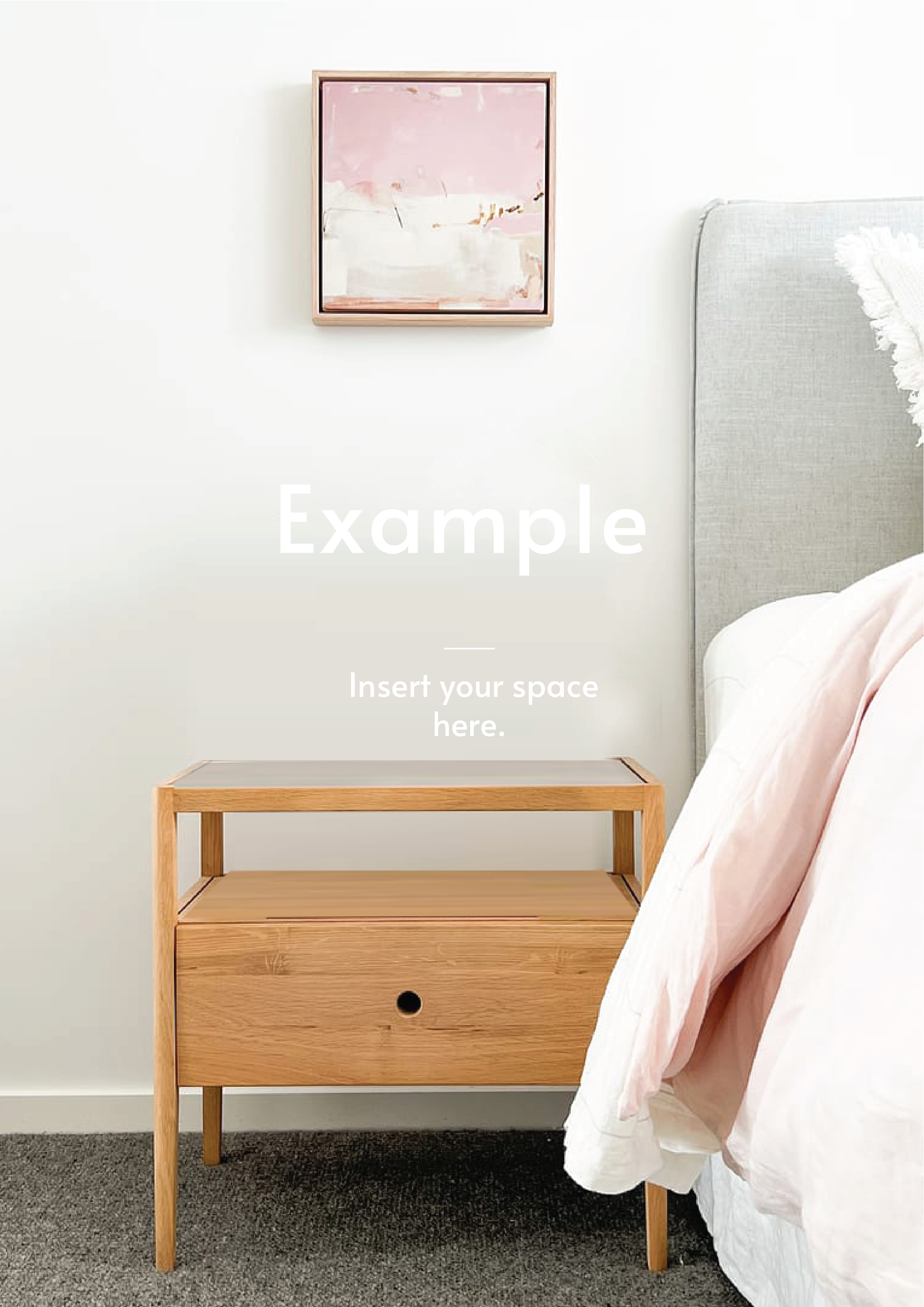 Minimalist wooden bedside table next to a gray upholstered bed with pink bedding and abstract pink wall art above, showcasing bedside table styling example.