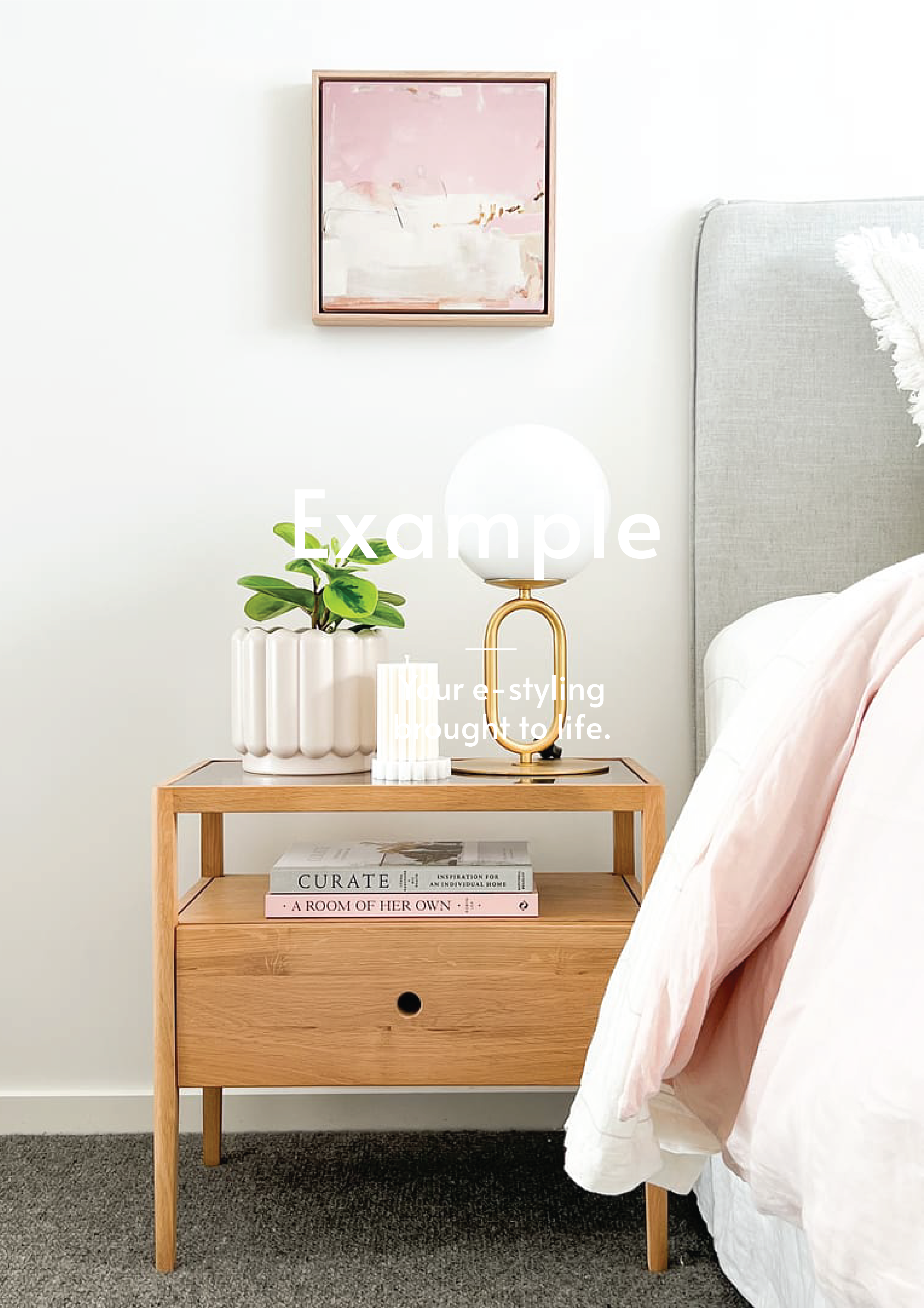 Modern wooden bedside table styled with a white lamp, green plant, candle, and books next to a bed with light pink bedding and a framed abstract art on white wall