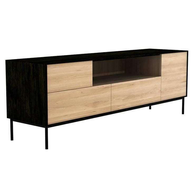 Ethnicraft Blackbird Entertainment Unit in black oak with one door, flip-down door, two drawers, and a raised metal frame.