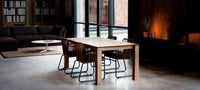 Ethnicraft Dining Table Slice made of natural oak with a simple design and subtle corner details in a modern living space.