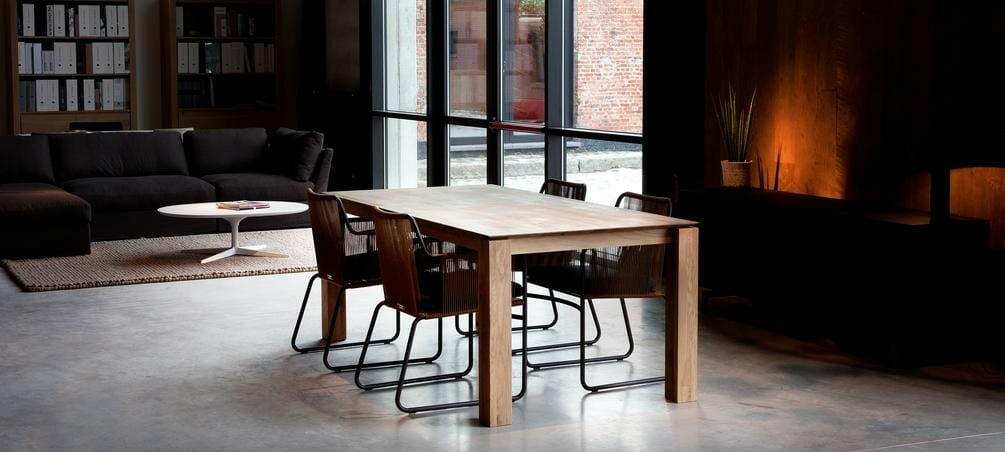 Ethnicraft Dining Table Slice made of natural oak with a simple design and subtle corner details in a modern living space.