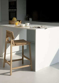 Ethnicraft N3 Kitchen Counter Stool made of natural oak with hardwax oil finish in a modern kitchen setting