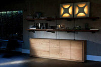 Ethnicraft Oak Shadow Sideboard in natural oak with four doors in a modern living room setting
