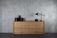 Ethnicraft Oak Shadow Sideboard made from solid European oak with natural finish, featuring clean lines and storage doors in a minimalist design.