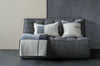 Dark grey Ethnicraft Sofa N701 2 seater with textured cushions and throw blanket