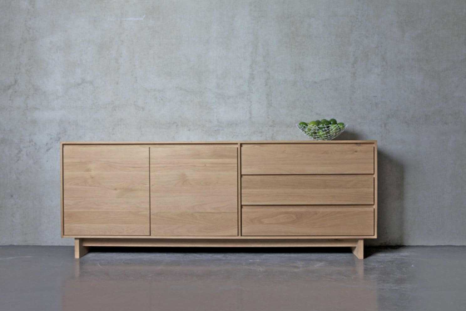 Ethnicraft Wave Sideboard large natural oak with 2 doors and 3 drawers against a grey wall