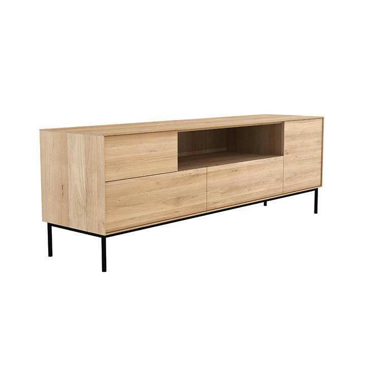Ethnicraft Whitebird Entertainment Unit made of natural oak with one door, one flip-down door, two drawers, and black metal legs