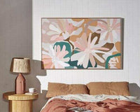 Kimmy Hogan Limited Edition Flowerbed III fine art canvas print with pastel floral design in floating oak frame above bed