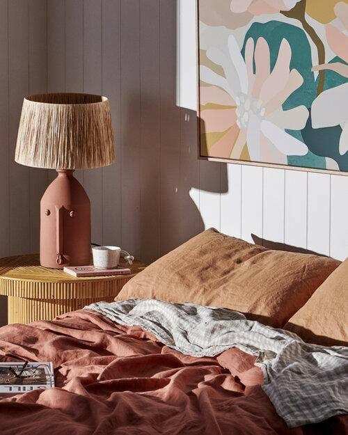 Kimmy Hogan Limited Edition Flowerbed III fine art canvas print with vibrant floral illustration displayed in a cozy bedroom setting