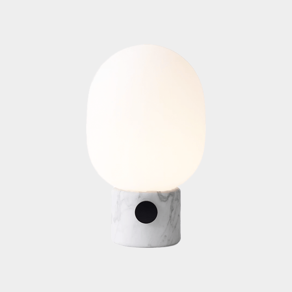 Menu JWDA Marble Lamp with Carrara marble base, frosted glass shade, and brass dimmer knob.