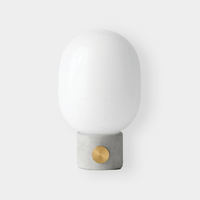 Menu JWDA Concrete Lamp with concrete base, brass dimmer knob, and white glass shade in minimalist modern design
